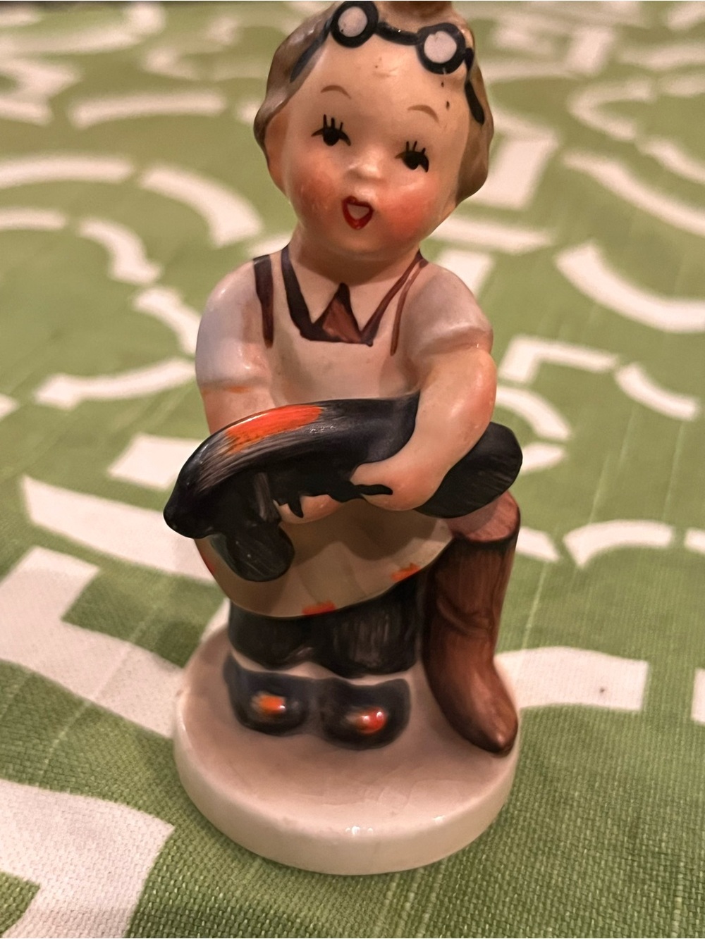 Porcelain Figurine Boy with Fish – White and Black Accents